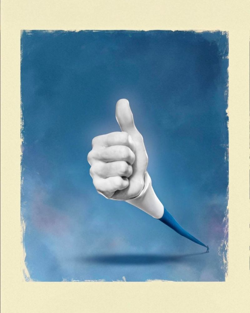 A white-gloved hand giving a thumbs-up.