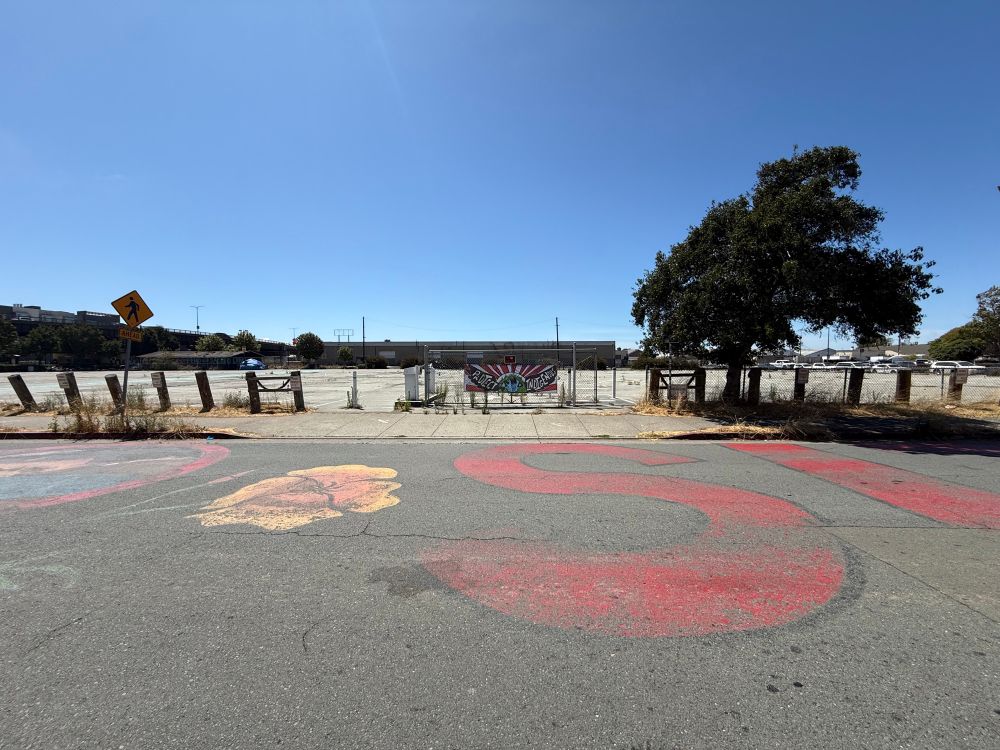 The indigenous land in question, which is a roughly one acre surface parking lot. 