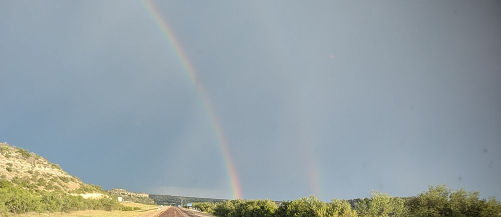 Double rainbow over a highway