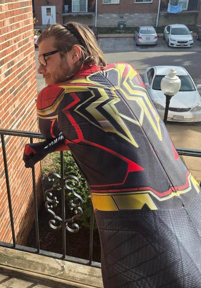 Monkee looking slightly back while showing off his backside in a Spider-Man suit, I don’t know which one, cosmic?!