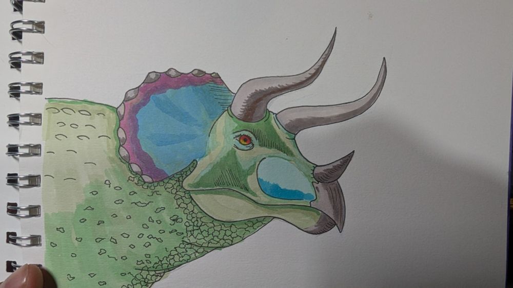 Green triceratops with purple and blue head.
