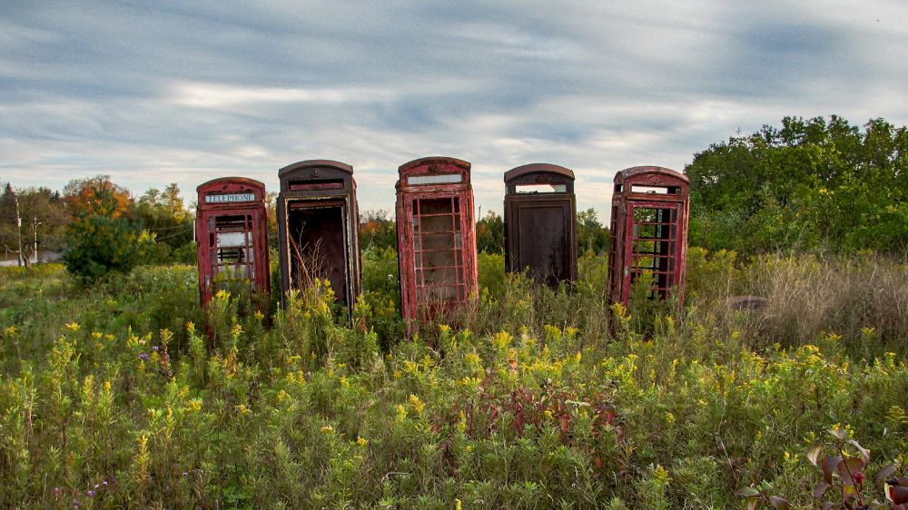 Abandoned Red Phone Booths, found in field north of Whitby - 2006. 
