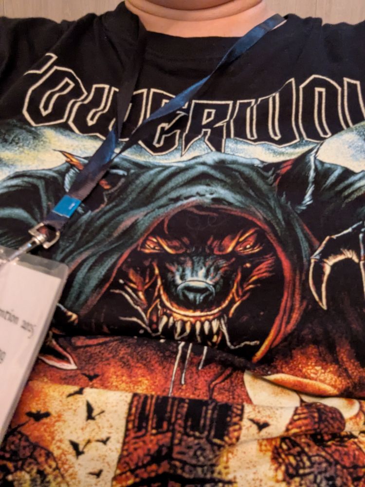 A snarling menacing werewolf with Powerwolf above its head. 