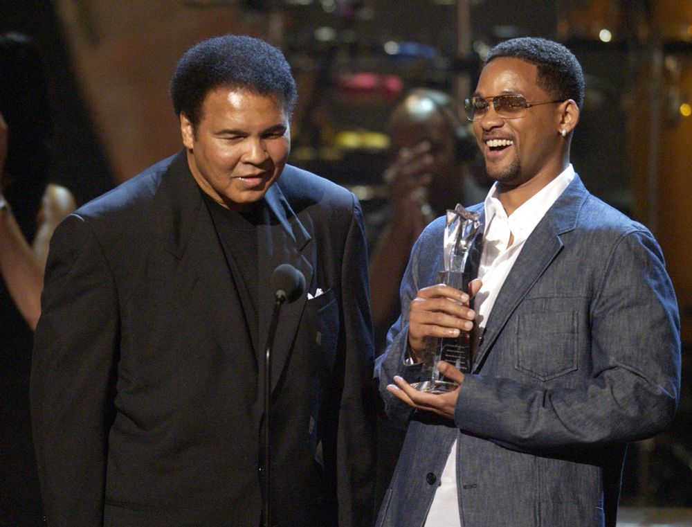 Muhammad Ali accepting his Humanitarian Award from presenter Will Smith during the 2nd annual BET Awards in Los Angeles on June 25, 2002.Michael Caulfield Archive—WireImage/Getty Images
