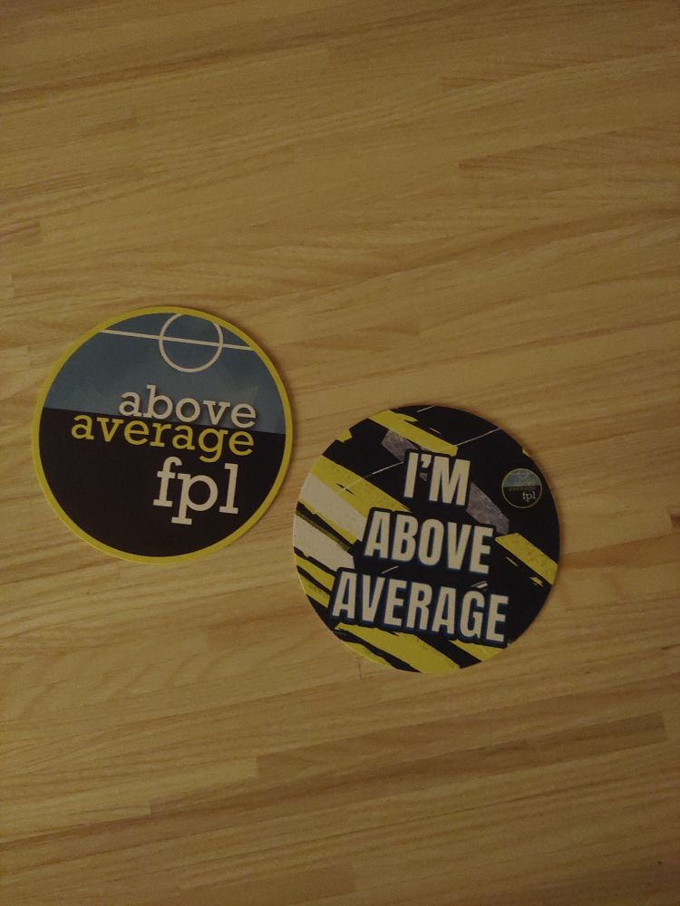 2 coasters
1 saying: above average FPL 
And the other: I'm above average