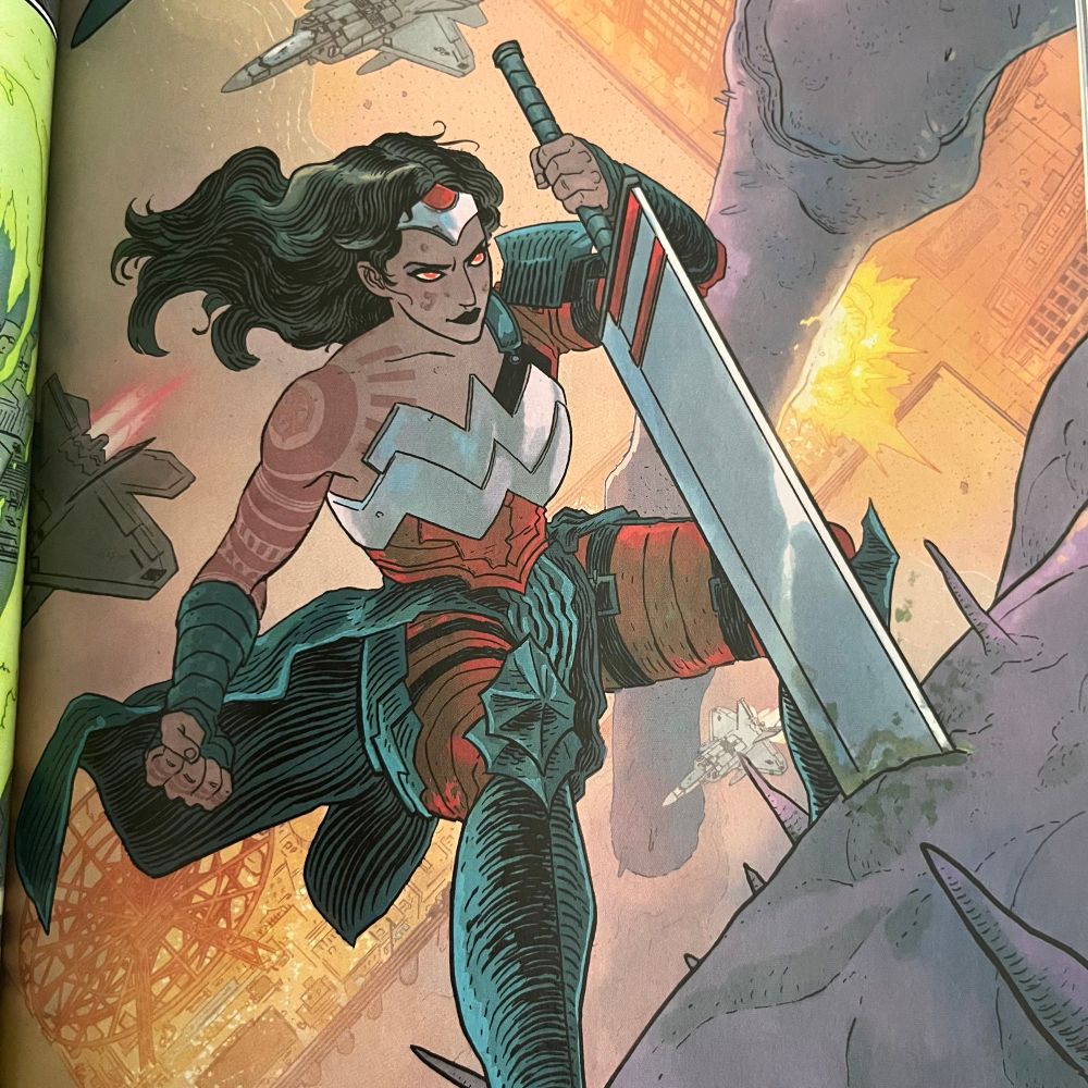 A panel from Absolute Wonder Woman of Diana with a big ass sword 