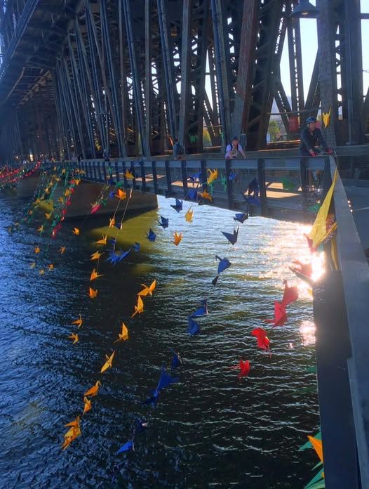 Origami Lady puts 1,000 cranes on Steel Bridge on August 6, 2015 -- The 70th anniversary of Hiroshima bombing. 