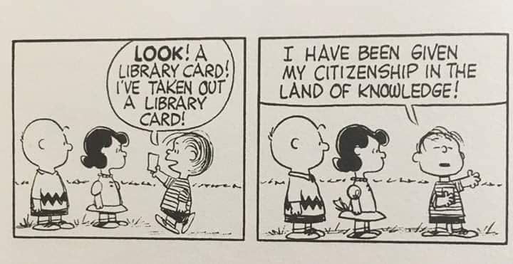 Charlie Brown, Lucy, and Linus are talking.  Linus holds up a card and says, "Look! A library card! I've taken out a library card!"

In the second panel Linus continues speaking, "I have been given my citizenship in the land of knowledge."