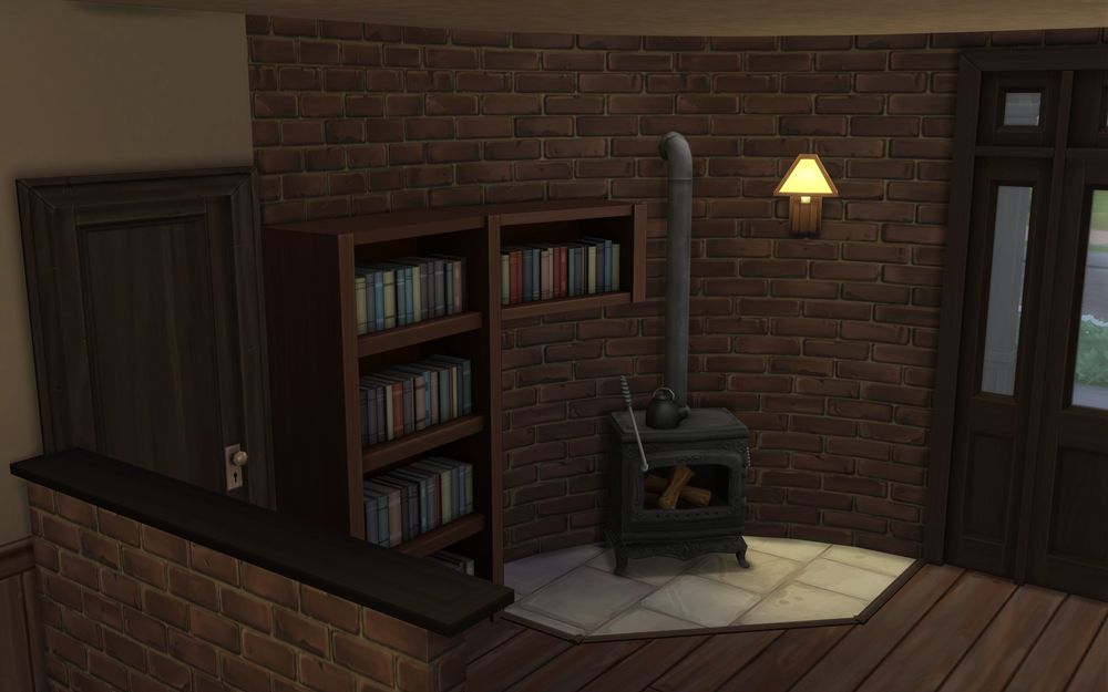 Close-up of the round wall that features a bookcase and fireplace. 