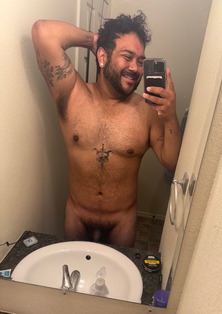 Arrow taking a selfie in his bathroom mirror naked. 