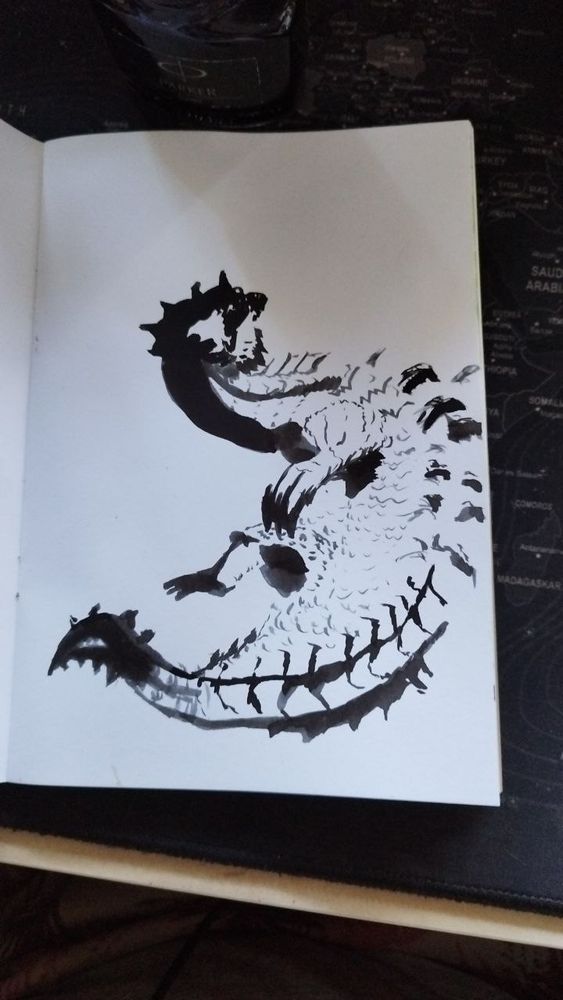 Ink drawing of a Lagiacrus on a sketchbook 