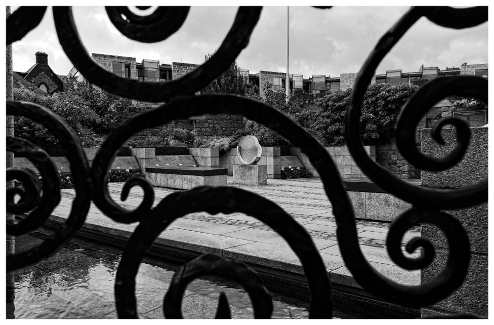 Looking through the gates into Dubh Linn Garden in the early morning