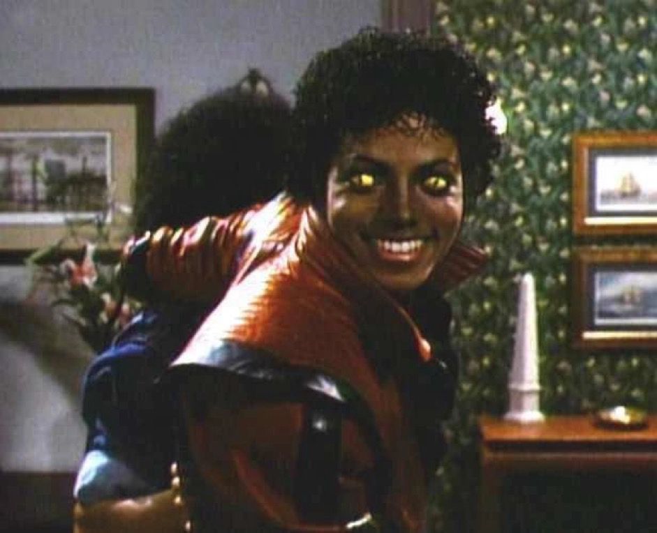 ss of  Michael Jackson from the music video thriller, when he turns to the camera and his eyes are evil with a big smile on his face. 