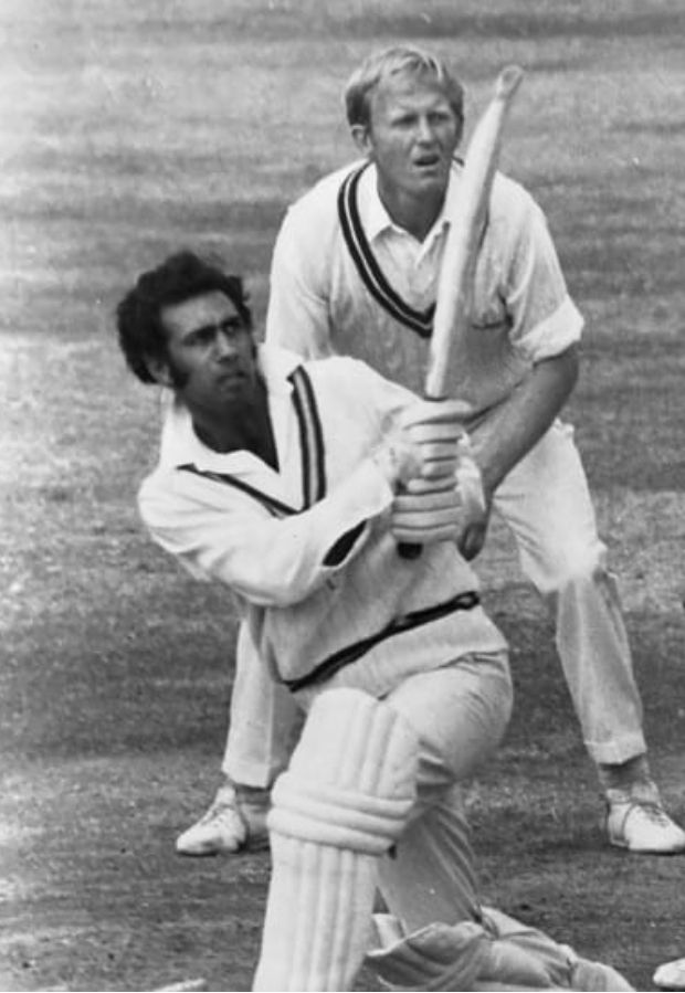 Basharat Hassan hitting the ball to leg side as slip fielder watches on