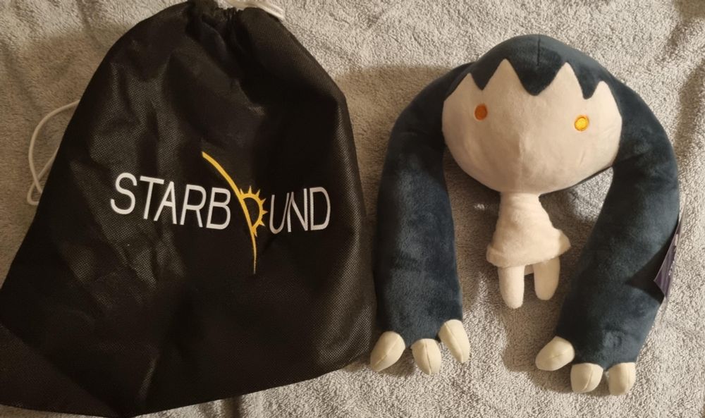 photograph of a plush "poptop" from the video game "starbound", it looks like if the pokémon mimikyu was mimicking hatsune miku