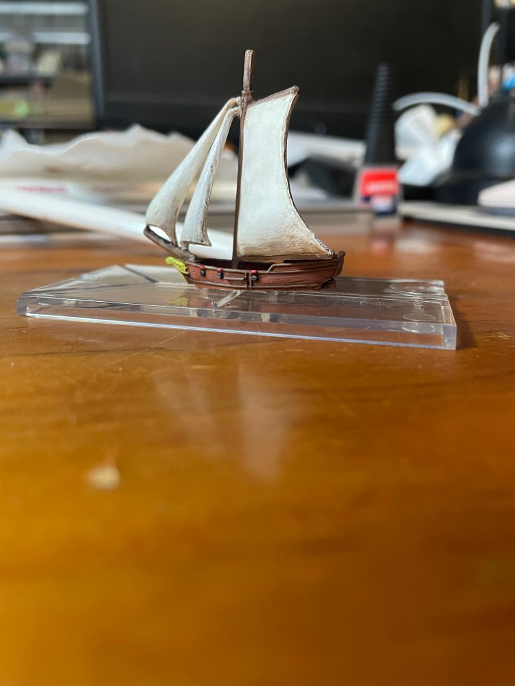 A port view of an Oak and Iron 600th scale sloop, painted.
