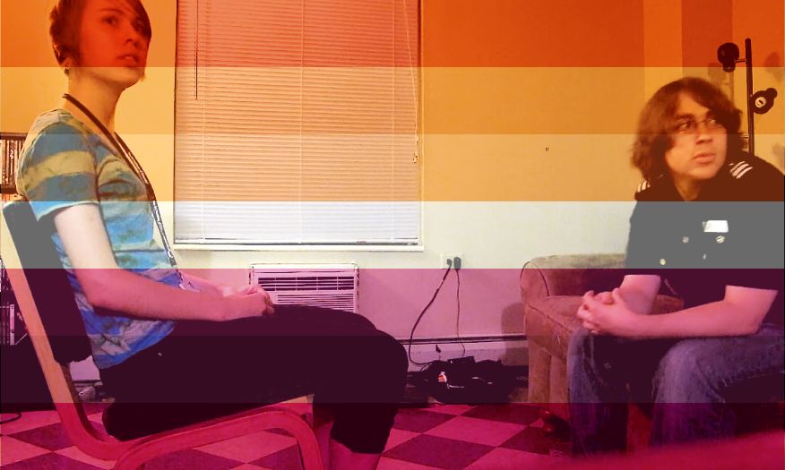 a picture of shaun and stormy from mlandersen0 sitting in chairs, overlayed with the lesbian flag