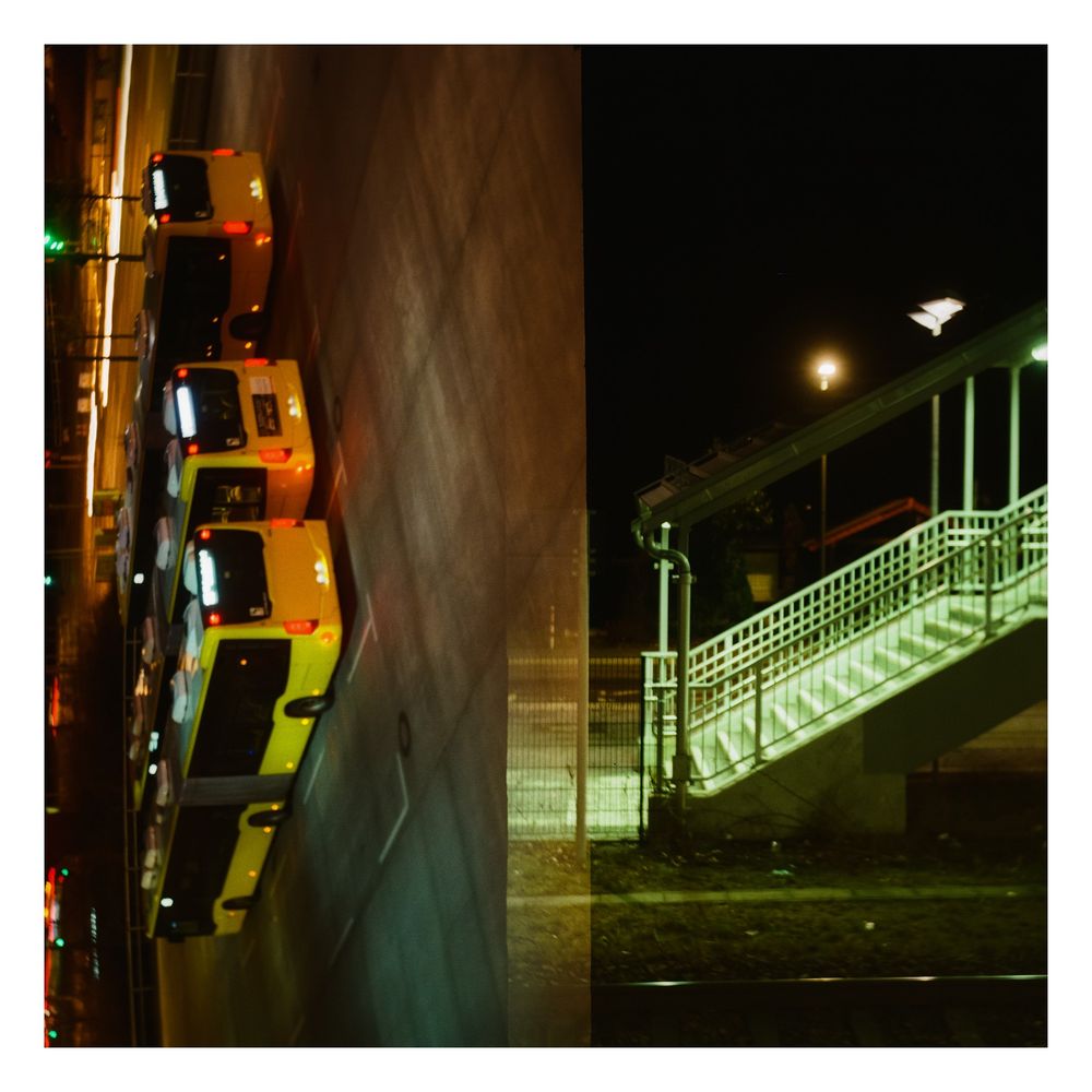A square color photo split in two: left, turned 90 degrees left, yellow busses in the night. Right greenly lit staircase in darkness. 