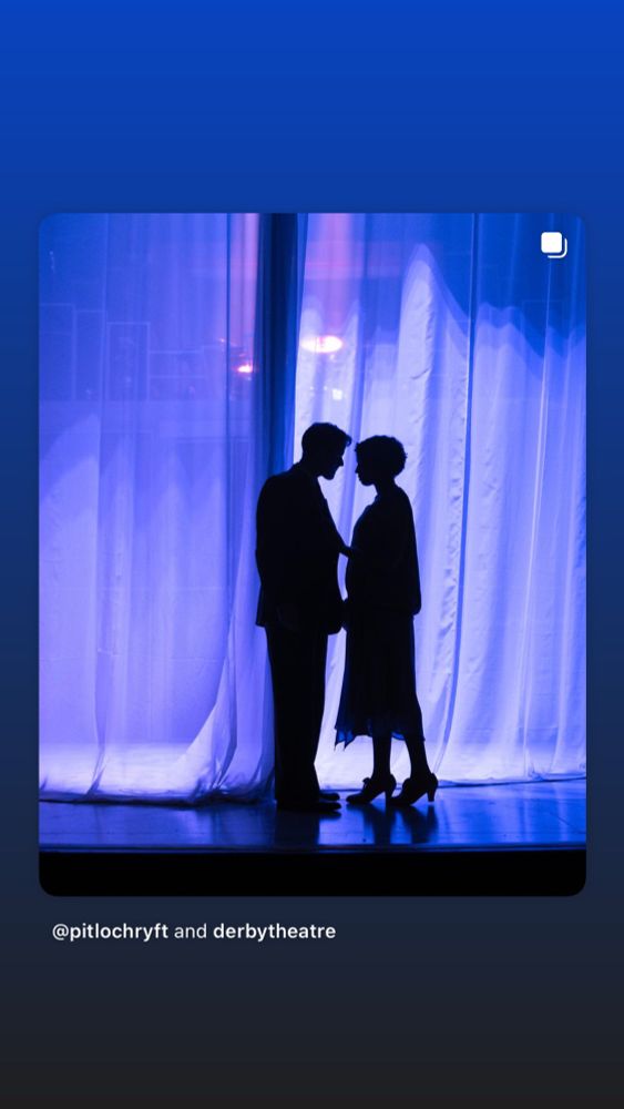 A man and woman in silohoute look like they may kiss 