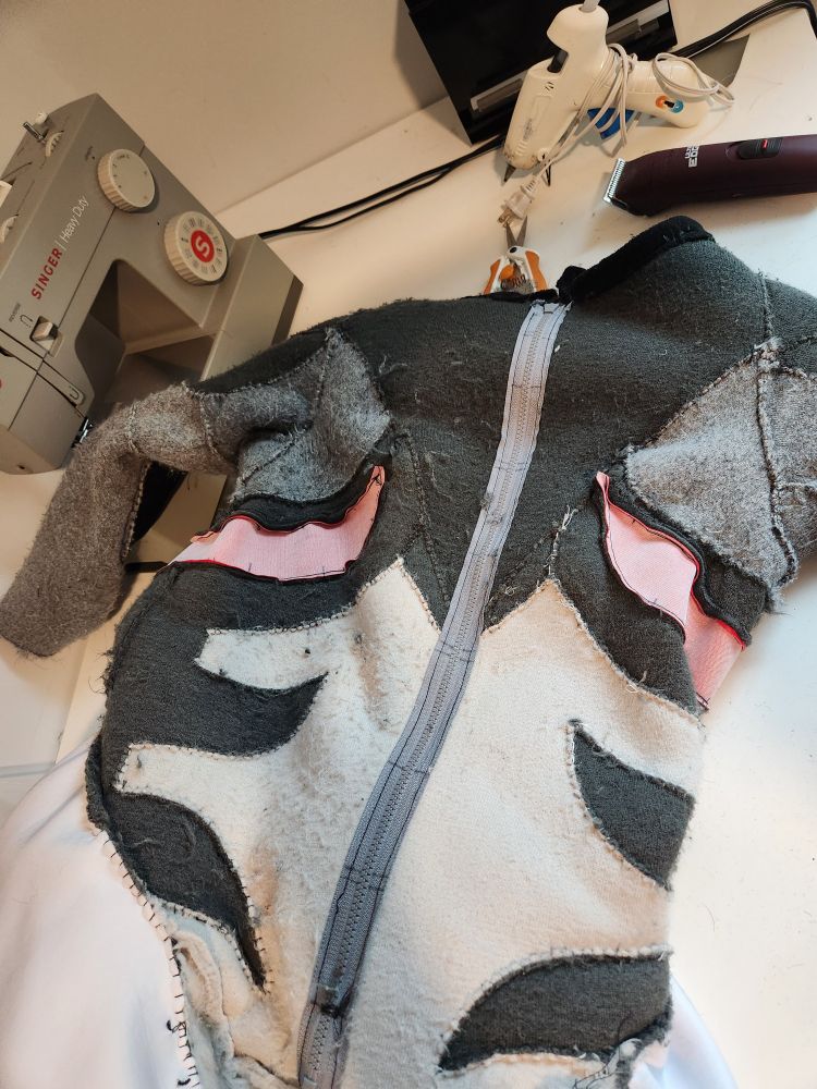 An inside out fursuit. The side on the left is bobbling. The right side has had the bobbling removed