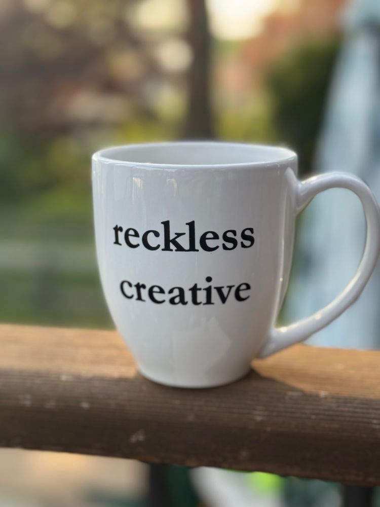  Full coffee cup sitting on porch railing on sunny morning