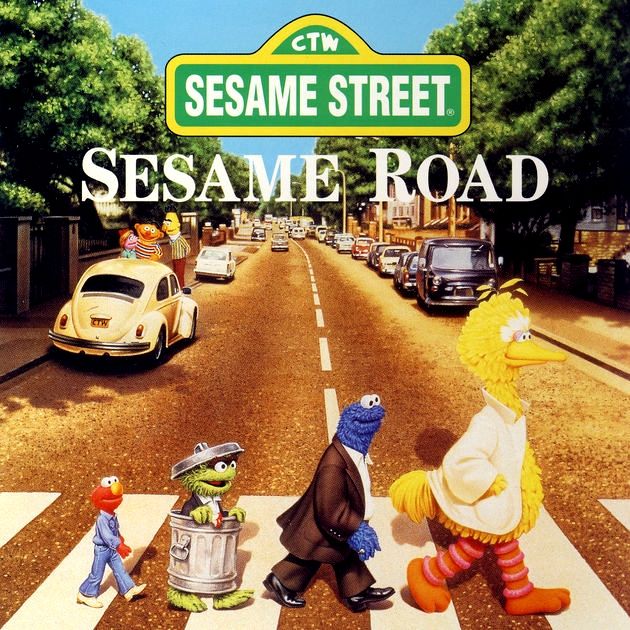 Sesame Street Sesame Road cover CD version with Big Bird, Cookie Monster, Oscar, and Elmo walking across a road in a parody of the Beatles "Abbey Road", released in 1993. 