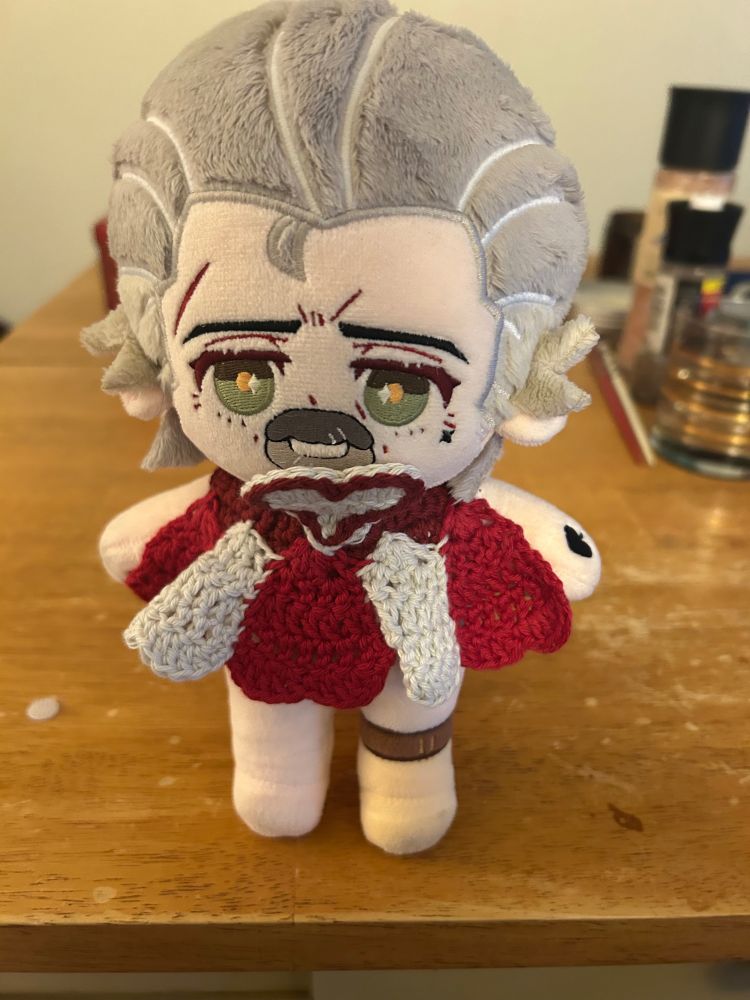 Izzy Hands doll looking very stylish in a red and white dress with a heart-shaped bodice. He is now ready to break all the hearts on the Seven Seas!