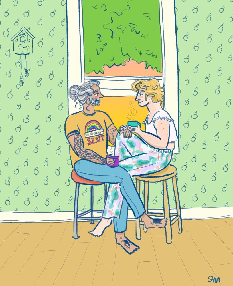 Ed and Stede sit on stools inside a house and beside a window. The sky is a peachy orange colour and trees partially obscure the view. Ed is wearing a mustard colour shirt that says "World's Greatest Slut" with a rainbow and jeans. Stede is wearing a brightly patterned pair of trousers and a cropped blouse with flouncy sleeves. They're both barefoot. The wallpaper has a fruit pattern on it and there's a cuckoo clock at the top left.