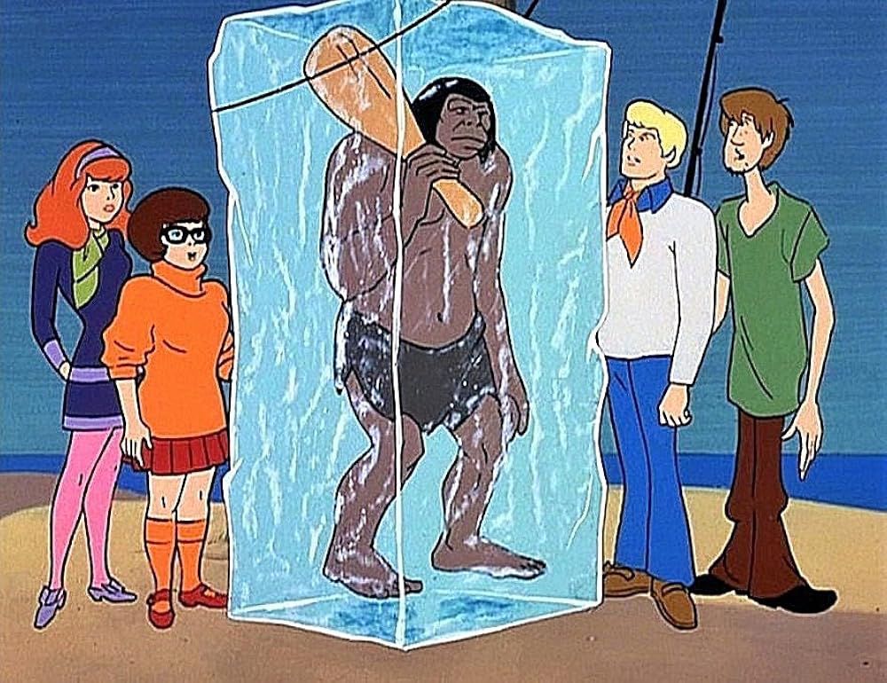 That caveman from scooby doo frozen in a block of ice with the scooby gang hanging around it.
