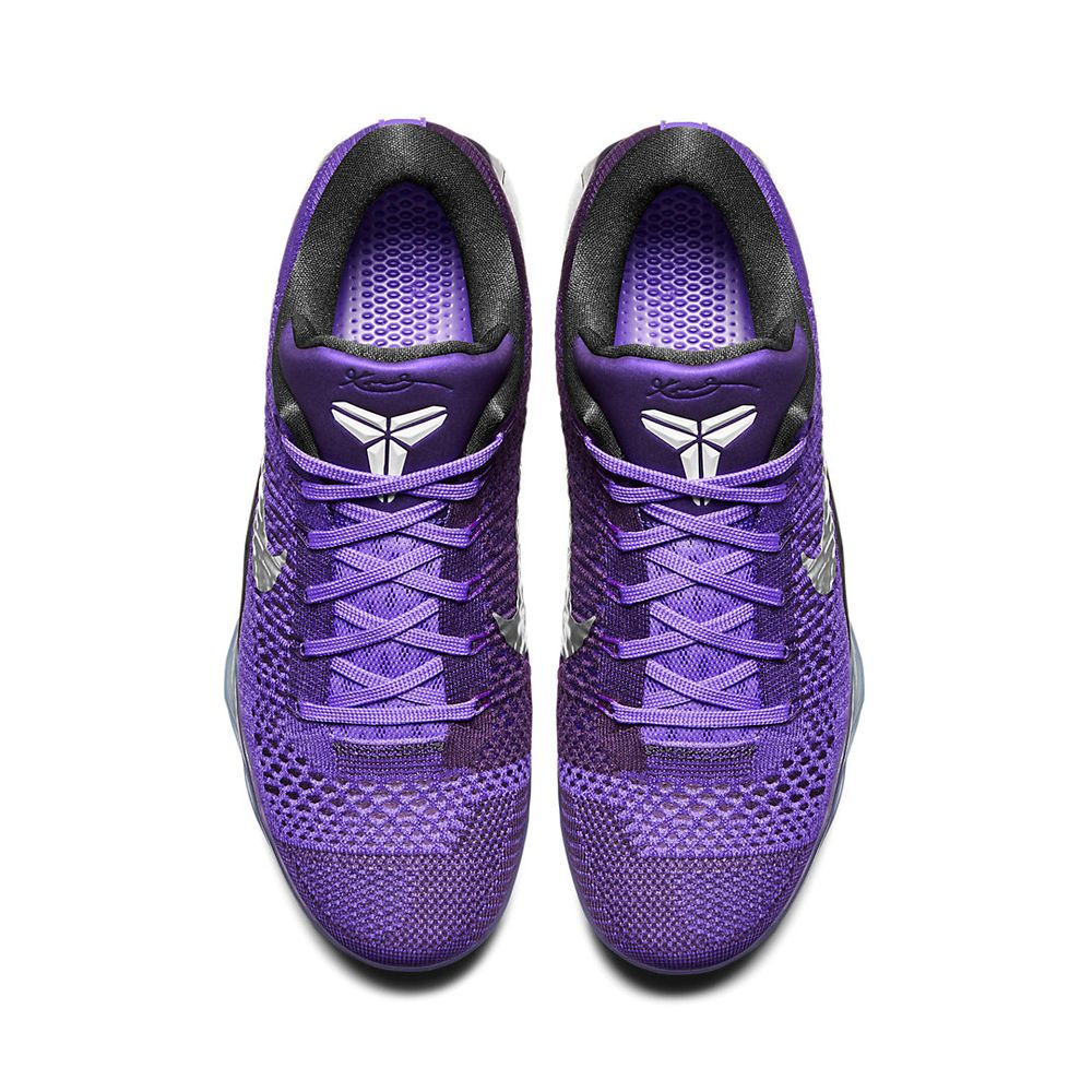 Nike Kobe 9 Low in the Moonwalker colorway:  Hyper Grape/White/Cave Purple. The striking purple woven one piece upper with a silver swoosh sits on top of a translucent outsole and black  carbon fiber heel cup.

This view is from above showing  the contrasting woven  areas with a dense weave for a towcap that juts slightly further back on the inside, then  an more open  weave for flexibility and breathability which fills out the toe. The inside and outside both have an open weave for breathability. The laces and tongue body are the same kind of woven texture in purple while the tongue's top is a glossy darker purple with Kobe's sword and scabbard logo is embossed in white. The toe and collar are both in black.
