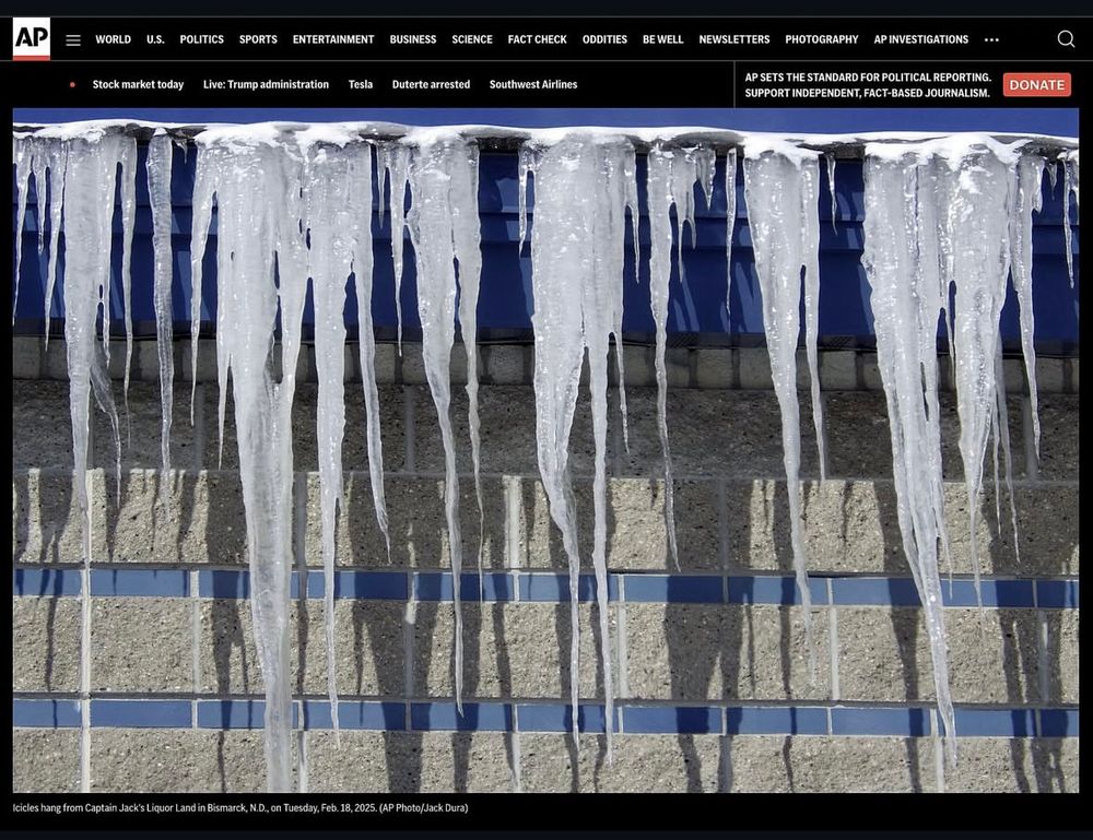 A picture of icicles hanging off a building