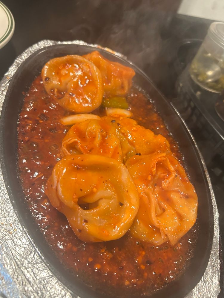Sizzling vegetable dumpling platter