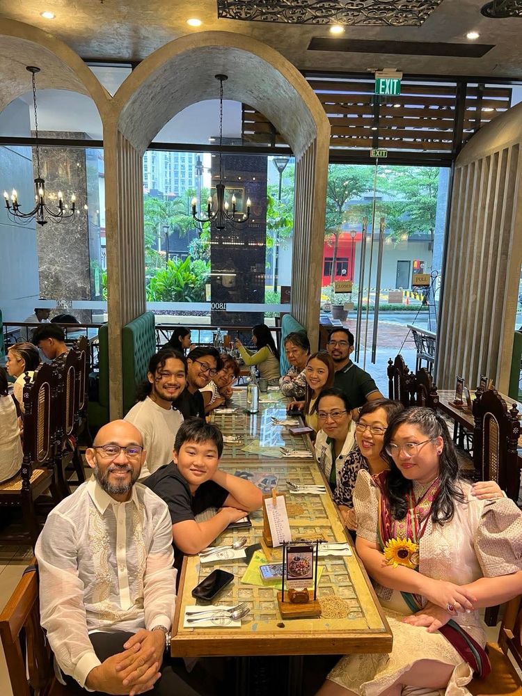 Photo of family in the Philippines celebrating my PhD graduation
