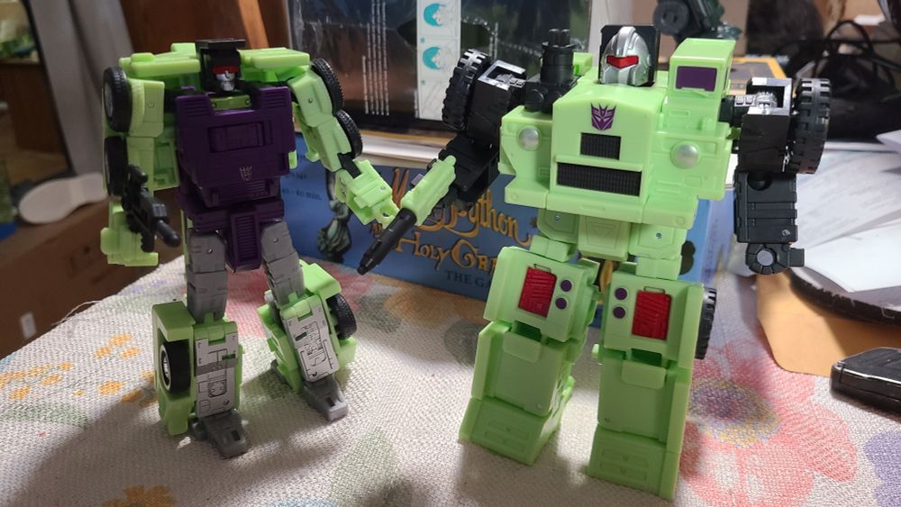 Transformers Age of the Primes Constructicon Hook and Constructicon Long Haul in their robot modes.