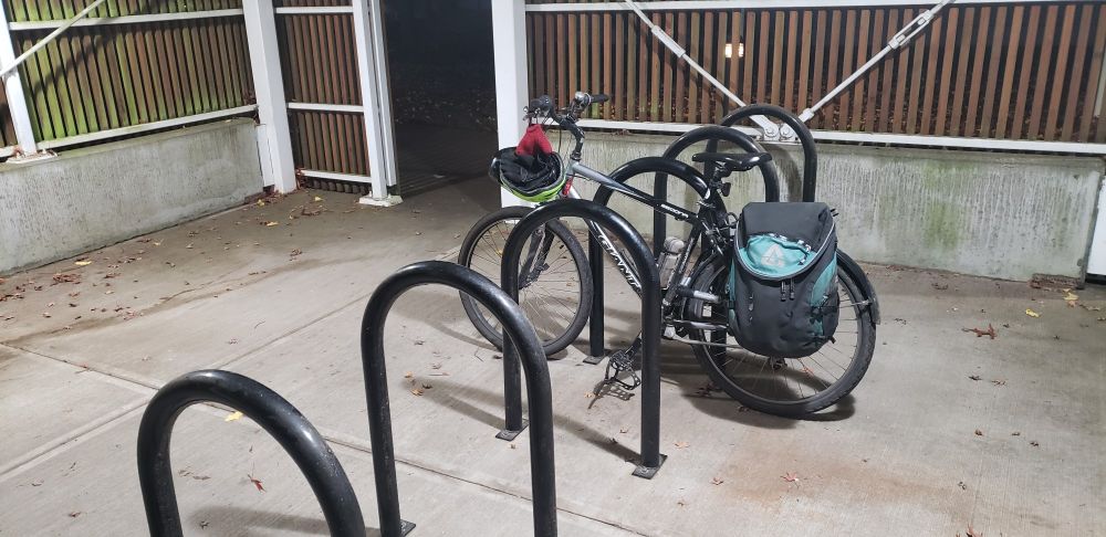 Roomy, covered, and well lighted bike racks at work. Sadly, only one bike parked here.