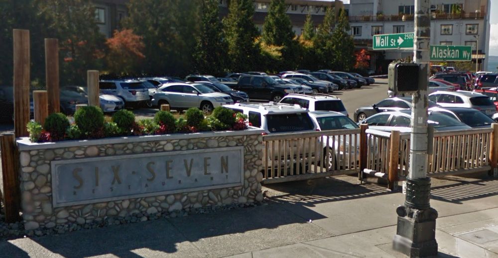 A photo of the sign outside the SIX-SEVEN restaurant, opposite the corner of Wall Street and Alaskan Way in Seattle.