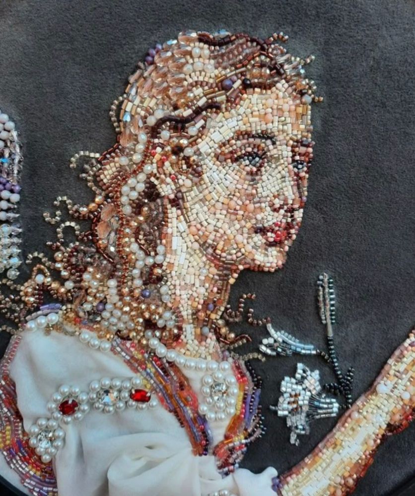 3/4 Portrait of a woman made of beads and fabric from https://www.instagram.com/sobaka_sutulaya.art/?utm_source=ig_web_button_share_sheet