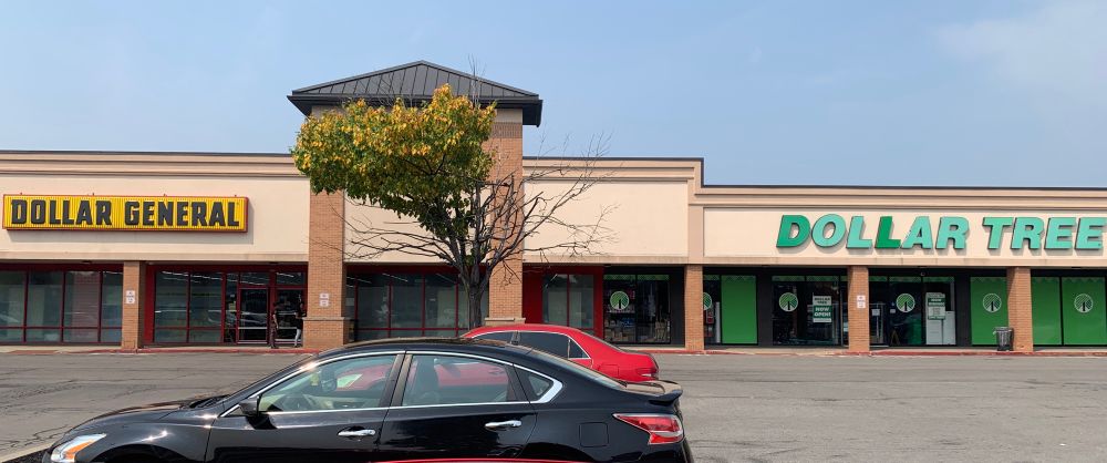 To the left, a Dollar General. To the immediate right, a Dollar Tree. 