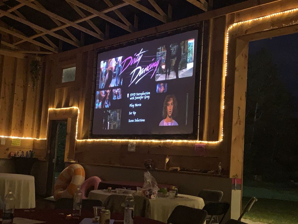 The DVD menu for Dirty Dancing on a large screen in a party barn in central Pennsylvania 