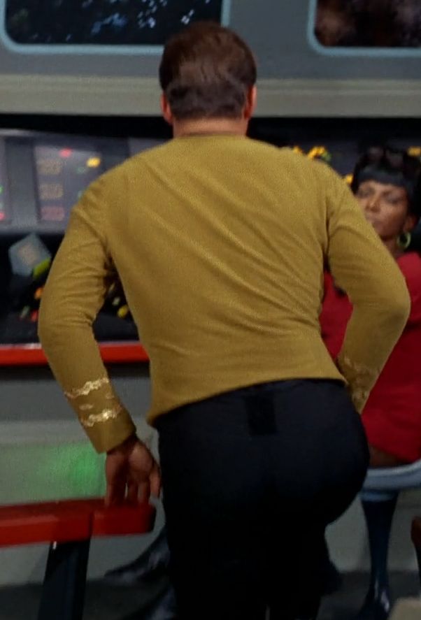 Shot of Kirk from behind as he goes up a step on the bridge of the Enterprise - his body is in a pose where you can see all the curves, the waist and the butt 
