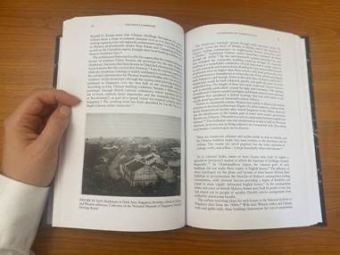 Image of a two-page spread of a book with historic black and white images.