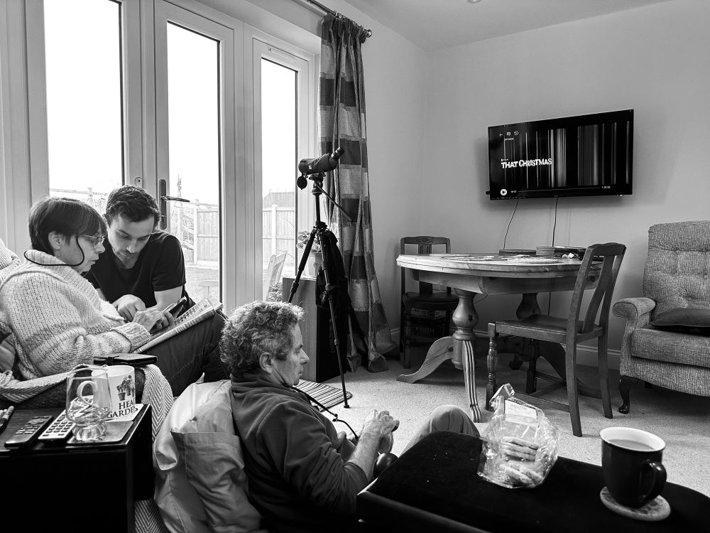 A family sit down to watch the Netflix film That Christmas