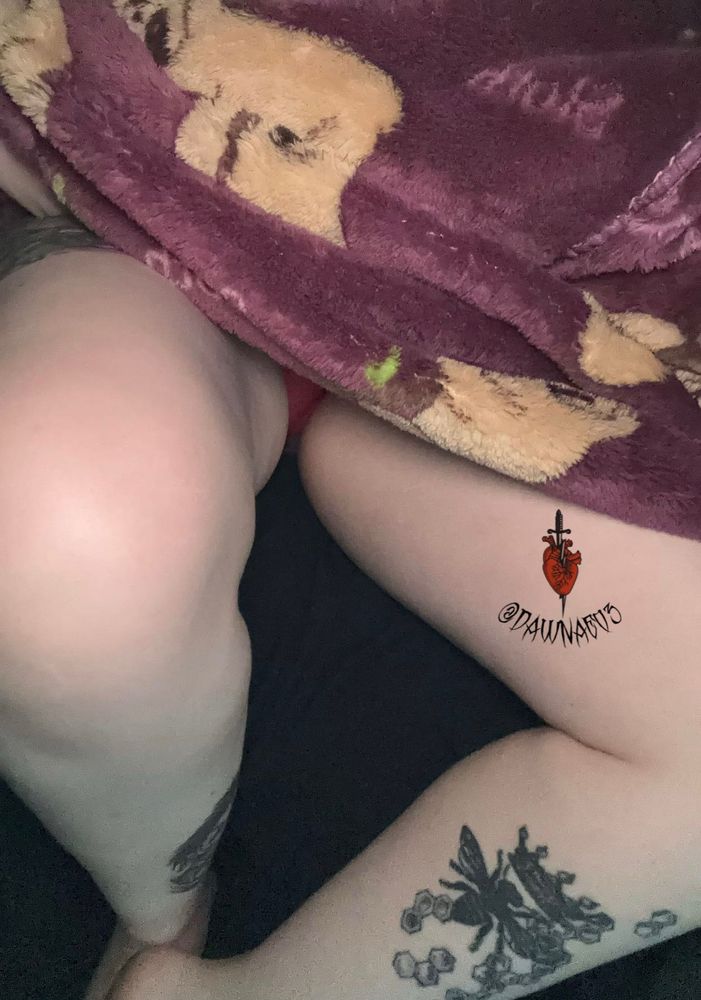 Faceless picture where model is wearing a purple blanket hoodie that had sloths on it! 
Thighs are main focus of picture! They are open with a little bit of their pink underwear peaking through! 
Their bee tattoo is very prominent in this photo!