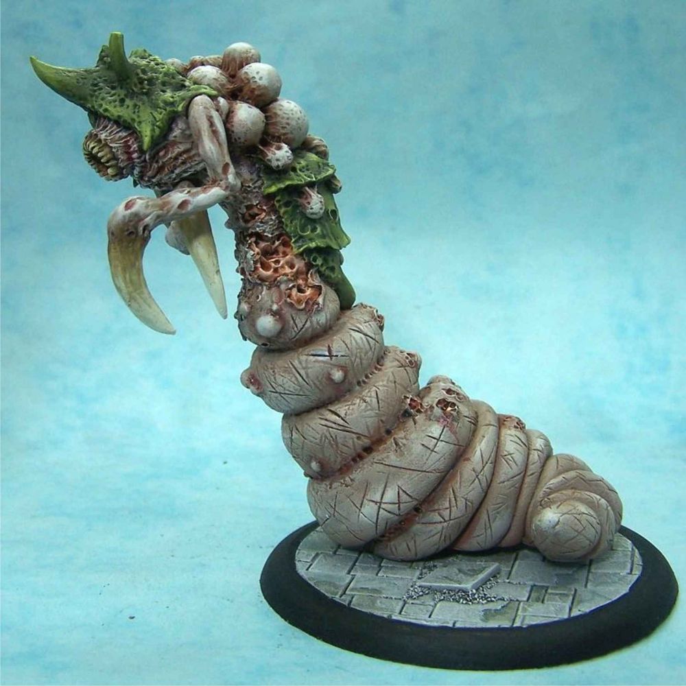 A 95mm tall maggot mother miniature.
With some green carapace pieces on the upper body, which isnstretched upward.

It has two claw like arms and a circular mouth with way too many teeth!