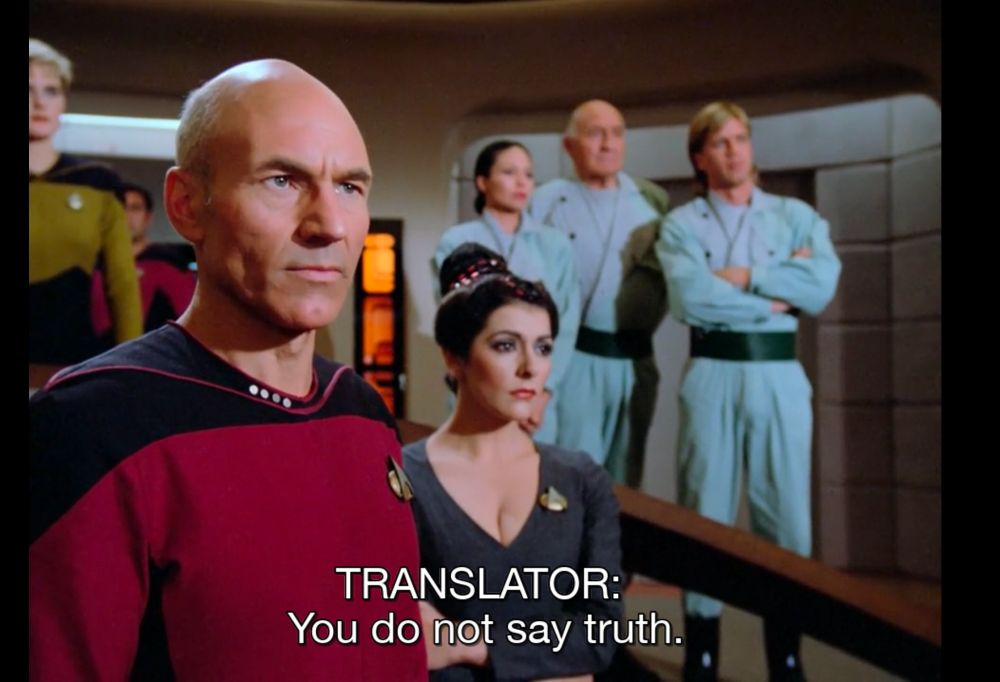 From the show Star Trek: The Next Generation. Picard and Troi on the bridge with Tasha and a terraforming team in the middle background out of focus. sub - "TRANSLATOR: You do not say truth."
