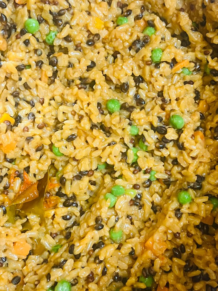 Brown and wild rice mix with onions, carrots, peas, garlic, and peppers.