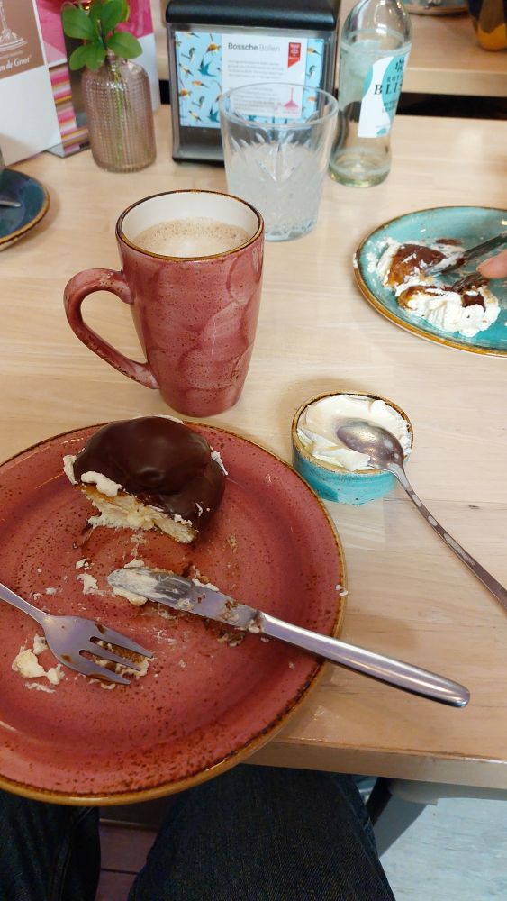 A half eaten bossche bol. A deliacy of Den Bosch. Fire.