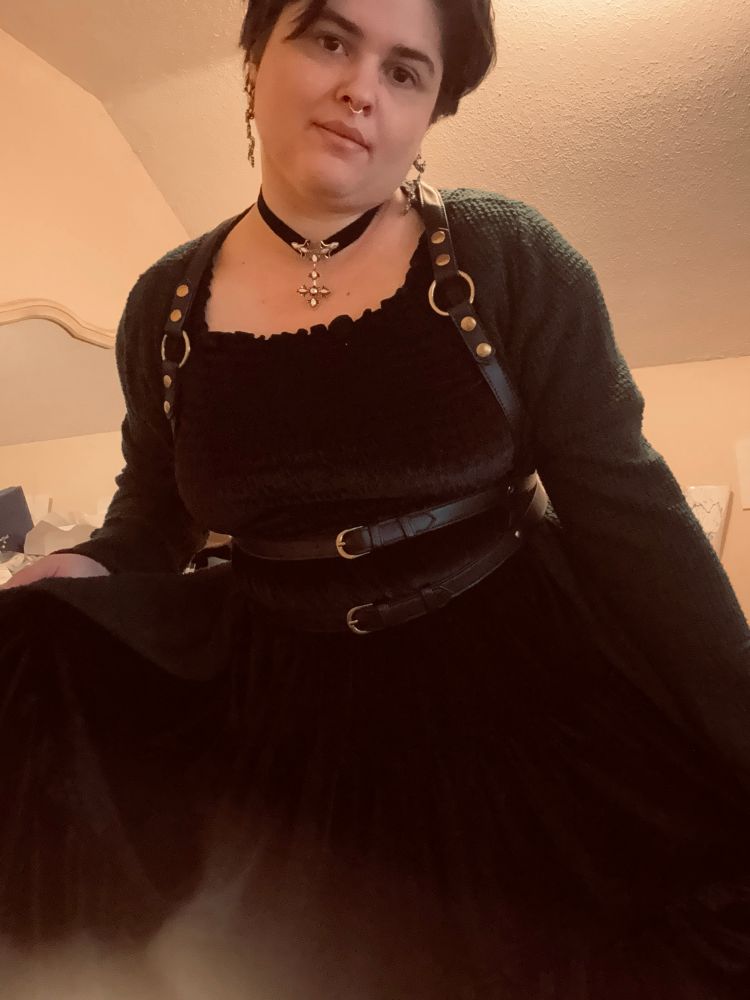 Madeline in black velvet dress and body harness 