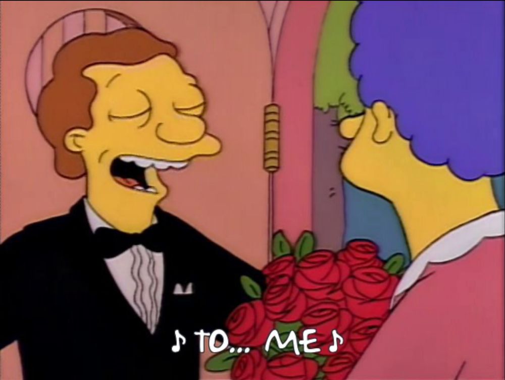 Screengrab of The Simpsons, singing telegram to Marge