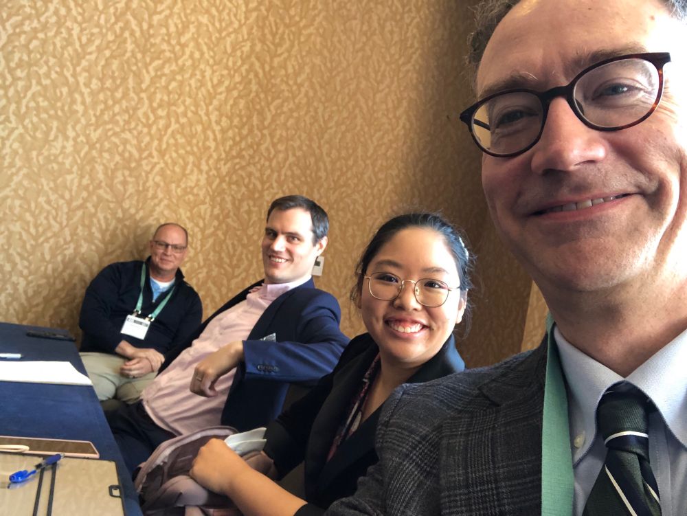 Selfie of 4 panel presenters from AAR 